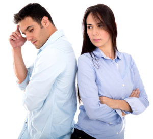 Angry couple fighting - isolated over a white background